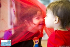 Toddlers participating in a play group aimed at reinforcing and teaching sign language to pre-verbal children