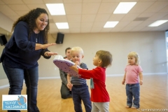 Toddlers participating in a play group aimed at reinforcing and teaching sign language to pre-verbal children
