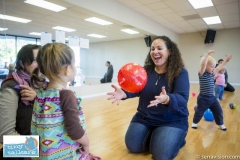 Toddlers participating in a play group aimed at reinforcing and teaching sign language to pre-verbal children