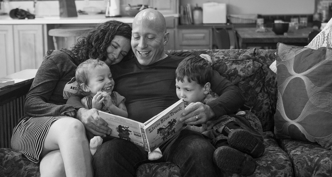 sweet family reading together - lifestyle family photo